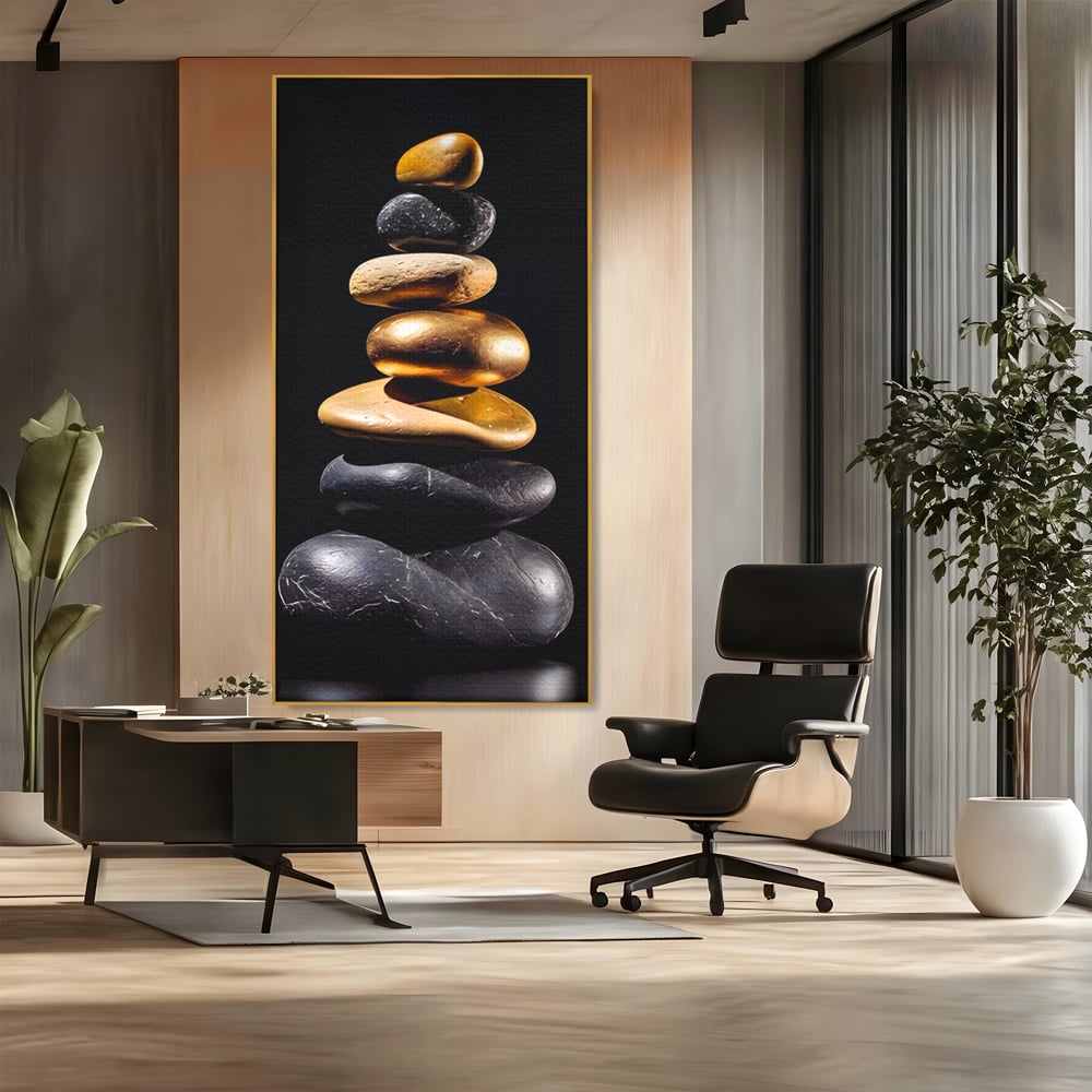 Tablou canvas cu turn vertical din pietre suprapuse, in rama de aluminiu auriu, pe perete intr-un birou